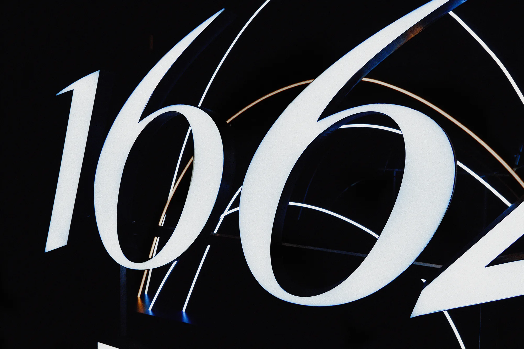 Close-up of the lit 1664 lettering