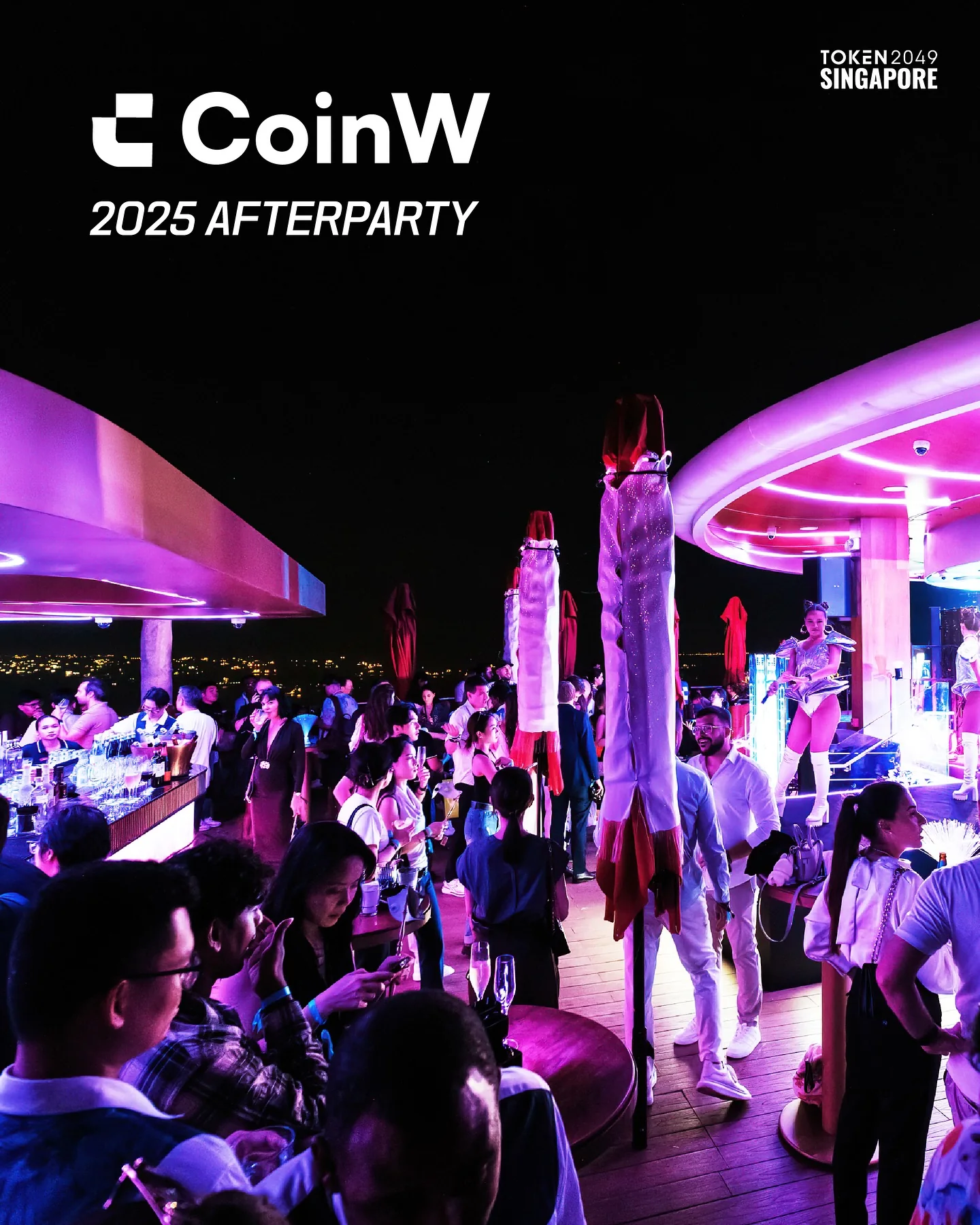 The CoinW 2025 Afterparty crowd on the rooftop at night
