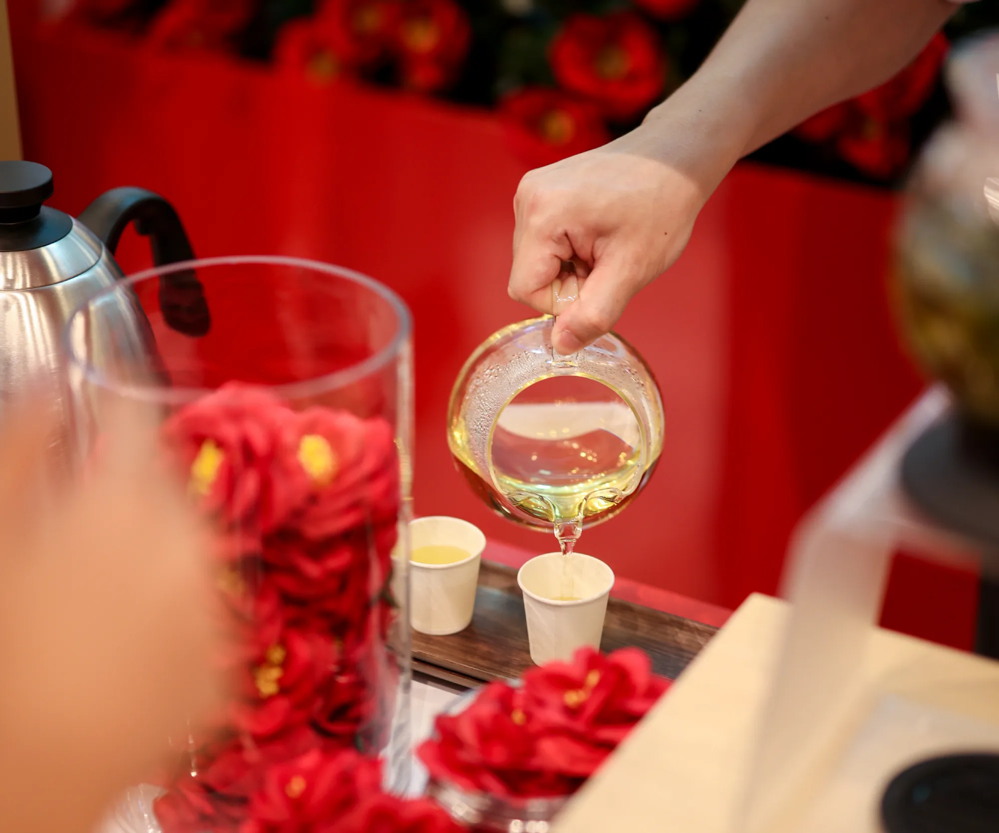 Camellia tea being poured at the tasting station