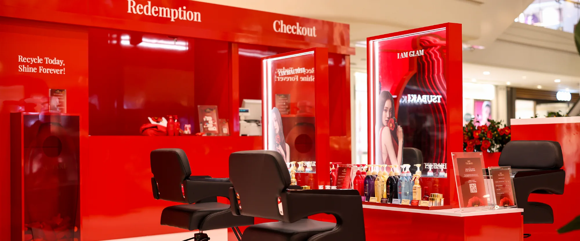 Styling chairs and mirrors in front of the redemption and checkout booth